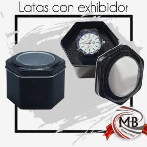Latas metálicas para relojes por mayor en Argentina. MB Comercializa: estuches hexagonales negros con ventana transparente y almohadilla de exhibición. Packaging mayorista con precios directos y despacho en 48 horas.